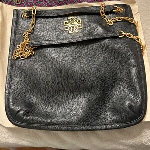 Never worn black crossbody authentic Tory Burch purse with dust bag.